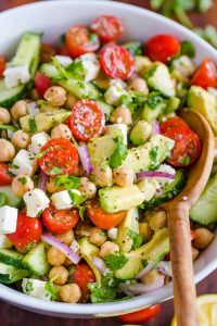 Chickpea Salad in Bowl with wooden spoon